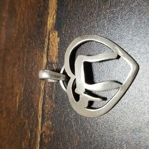 Sterling silver pendant, stamped 925,about an inch wide.